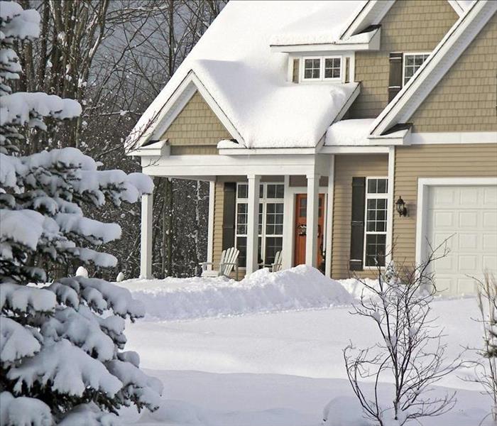 Image of house and yard covered with snow